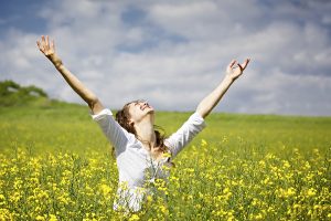 bigstock-Young-woman-standing-in-yellow-19498895